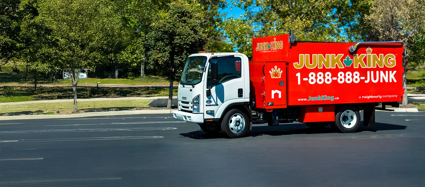 A red Junk King dump truck.