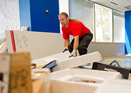 Junk King professional cleaning an office space.