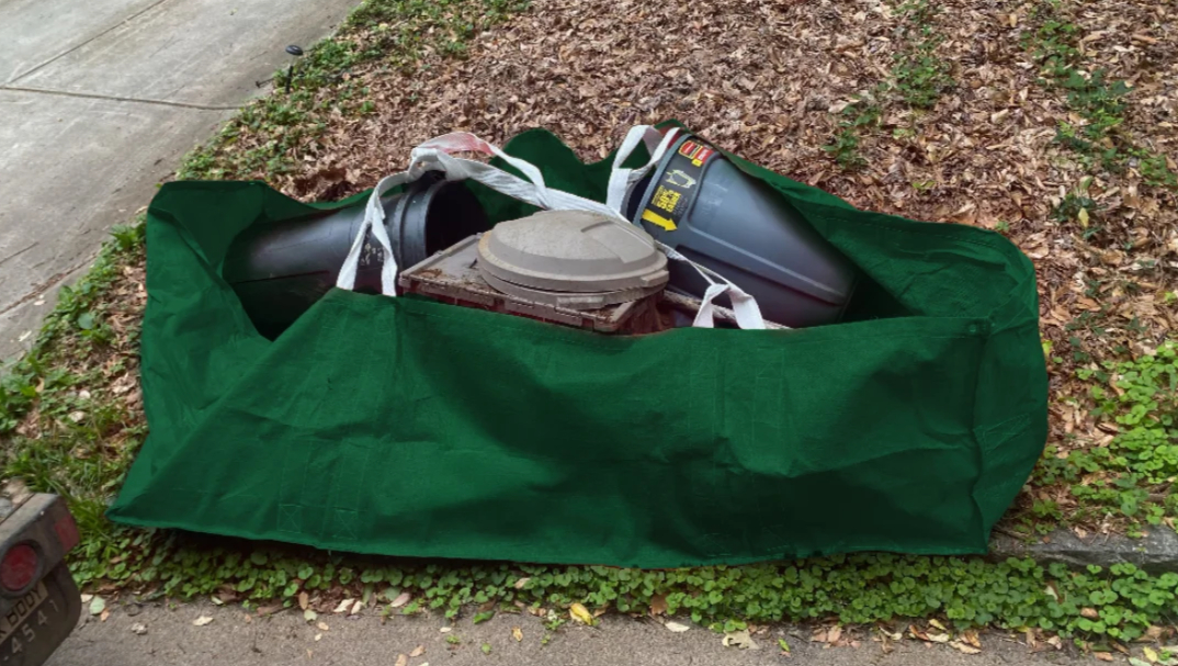 Junk King dumpster bag filled with old junk.