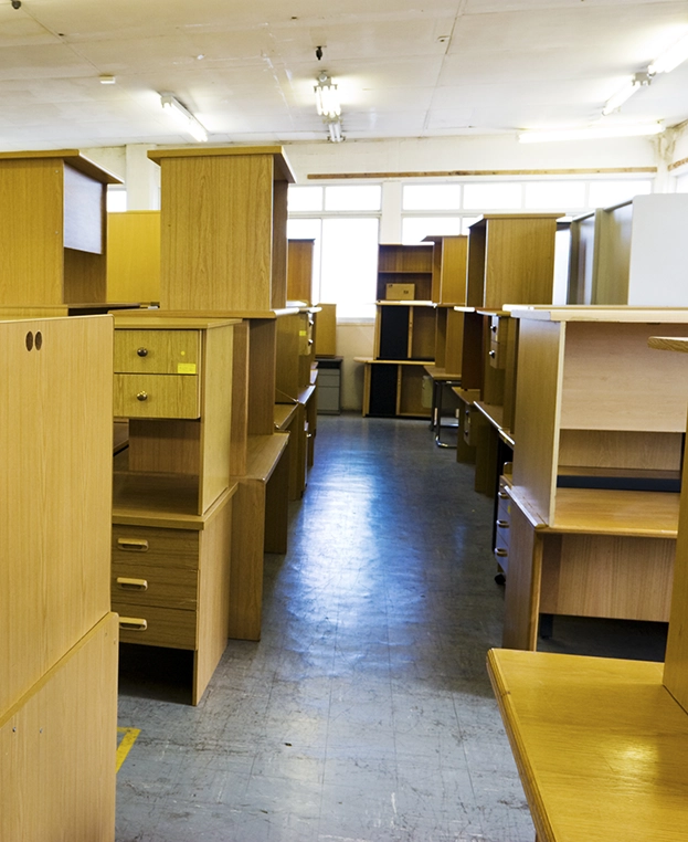 Room with a lot of old wooden desks.