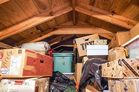 Image of an attic full of boxes.