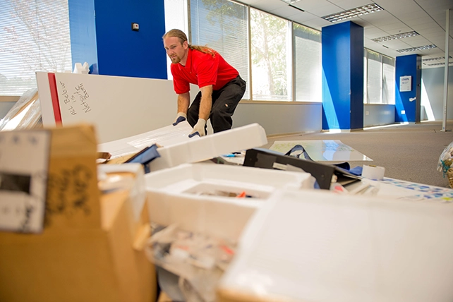 Junk King professional removing items from a commercial building.